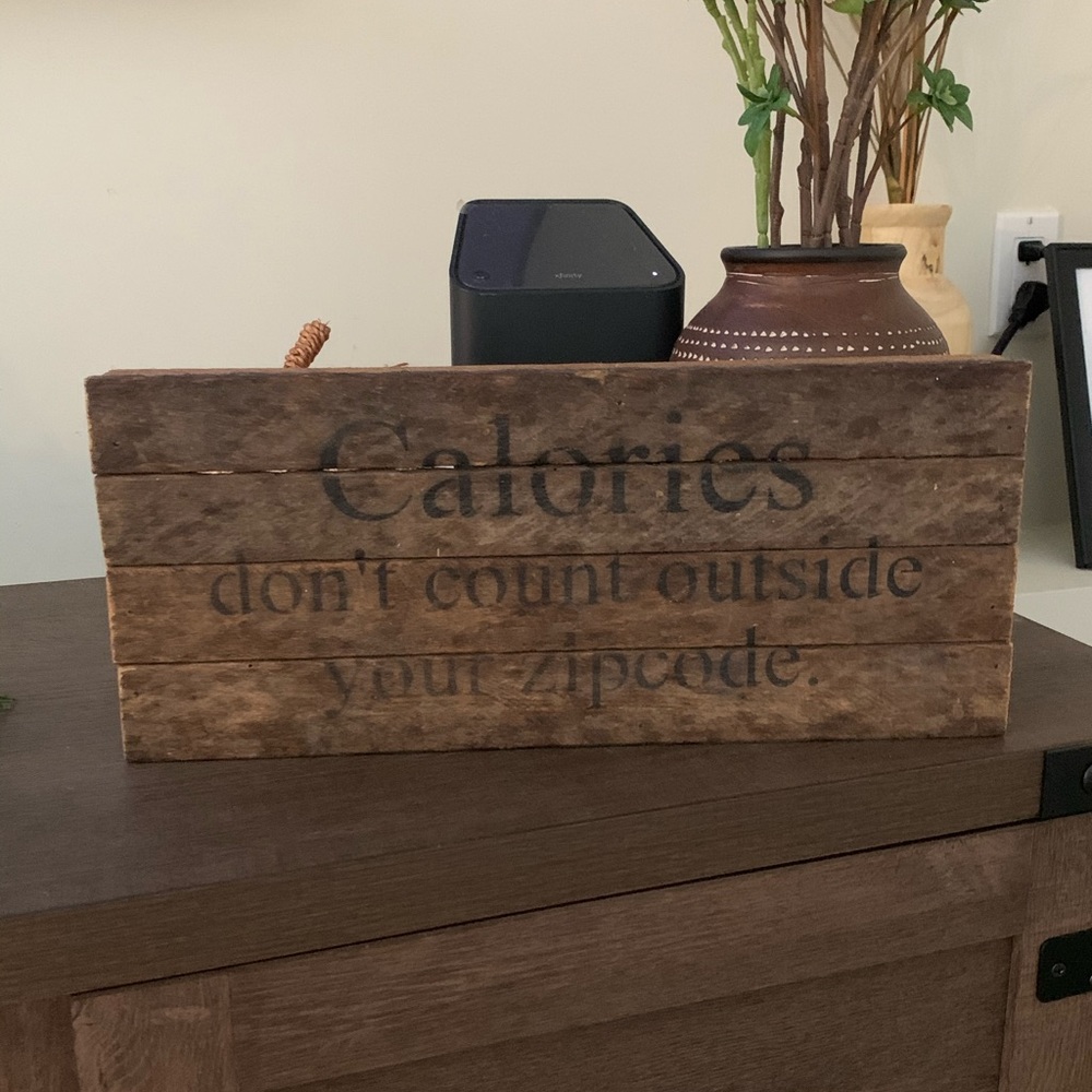 Wood sign decor “Calories don’t count outside your zip code”